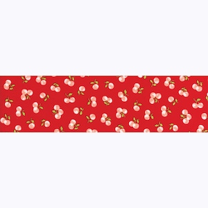 May include: Red fabric with a repeating pattern of white cherries on green stems.