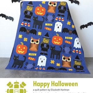 May include: A blue Halloween-themed quilt featuring repeating patterns of a witch, pumpkin, owl, black cat, spider, ghost, candy corn, and bats. The quilt has the text "Happy Halloween".