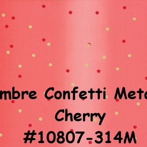 May include: Red ombre fabric with gold and red confetti. The fabric has the text "Ombre Confetti Metallic - Cherry #10807-314M" printed on it.