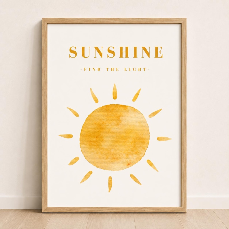 Cheerful yellow sunshine wall art print in a light wood frame