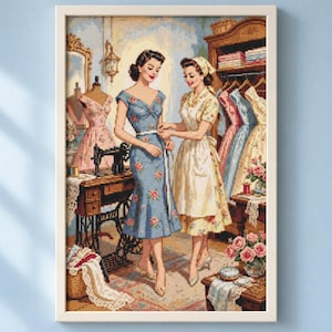 May include: A framed cross-stitch embroidery depicting two individuals in a sewing room. One wears a blue floral dress while the other wears a yellow patterned dress and apron. A vintage sewing machine sits on a wooden table nearby.