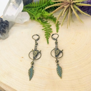 Antique bronze southwest cow skull earrings, patinaed leaf charm, western, boho style, country jewelry, lever back, dangle, charm earrings