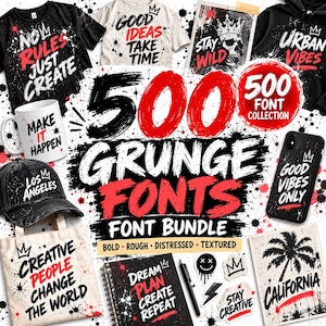 May include: A digital collection of 500 grunge fonts featuring bold, distressed, and textured typography. The display includes various items like t-shirts, a mug, a cap, a phone case, and a notebook, all showcasing graphic designs with paint splatters.