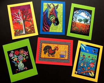 May include: Set of six colorful greeting cards with various illustrations. The cards feature a tree, a zebra, a gate with flowers, a rooster, a vase of flowers, and a scene with fish and a bird.