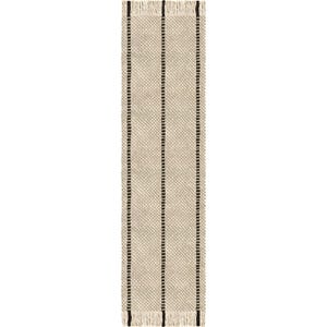 May include: A rectangular table runner featuring a woven beige and cream textured pattern with three vertical black stripes running the length of the fabric. The top and bottom edges are finished with short, cream-colored fringe.
