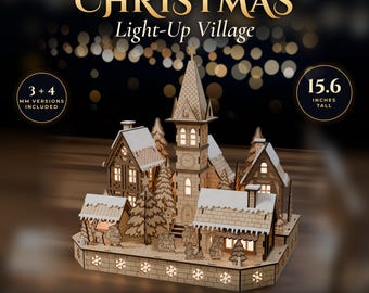 May include: A laser cut wooden Christmas light-up village model featuring a central clock tower, multiple houses, and festive figures. The structure stands 15.6 inches tall and includes 3 and 4 mm versions. Text includes LASER CUT FILE, INSTANT DOWNLOAD, CHRISTMAS Light-Up Village, SVG, DXF, PDF, EPS, AI, and FITS 300 x 200 MM BEDS.