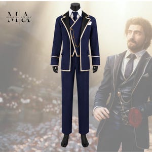 May include: A dark blue suit featuring a jacket with black lapels and cream piping, a matching waistcoat with a gold chain detail, a white collared shirt, and trousers. The Medieval Atelier logo is visible in the upper left corner of the image.