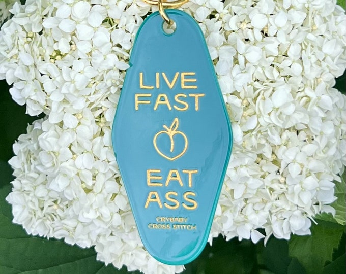 Live Fast Eat Ass motel keychain