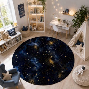 May include: A large circular area rug featuring a deep navy blue background with a celestial pattern of golden stars, glowing nebulae, and white constellation lines. The design depicts a night sky theme with scattered points of light.