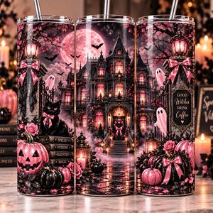 May include: A cylindrical tumbler featuring a pink and black Halloween theme with a haunted mansion, a full moon, bats, ghosts, a black cat with a pink bow, pink pumpkins, and a sign that reads Good Witches Drink Coffee with a metal straw.
