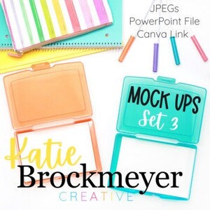 May include: Two clear plastic containers with white inserts. The containers are labeled "MOCK UPS Set 3". The containers are on a white surface with colorful stationery and a notebook.