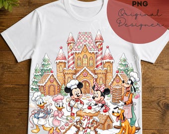 May include: A white short-sleeve t-shirt featuring a colorful graphic of cartoon characters baking in front of a gingerbread castle. The design includes Mickey, Minnie, Donald, Daisy, Goofy, and Pluto wearing chef hats and aprons with candy accents.