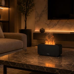 May include: A rectangular black tabletop device featuring a central slot that emits a simulated orange flame effect. The unit has a smooth, matte finish with three small circular control buttons aligned horizontally on the front lower panel.