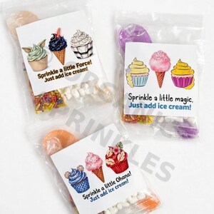 May include: Three clear plastic pouches containing colorful sprinkles and marshmallows, each with a white label featuring illustrated cupcakes, ice cream cones, and the text Sprinkle a little Force! Just add ice cream!, Sprinkle a little magic. Just add ice cream!, and Sprinkle a little Ohana! Just add ice cream!
