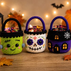 May include: Three crocheted baskets for treats. The first is lime green with a Frankenstein face, the second is white with a colorful sugar skull design, and the third is purple with a black roof, yellow windows, and a white spiderweb.