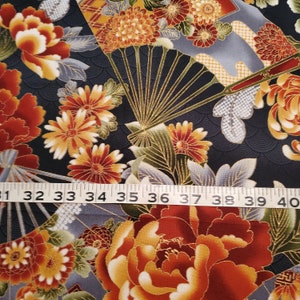 Large rust colored mums with gold accent fabric on fans, unknown designer
