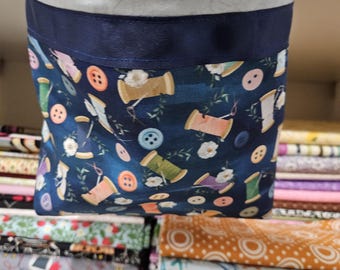 Scrap and thread catcher, snips bag with attached pin cushion, sits on the edge of your sewing table with gripping fabric