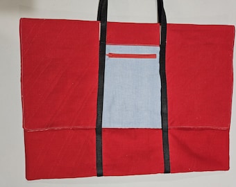 Carrier or tote for cutting mat, rulers and other sewing items.