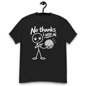 May include: A black short-sleeved t-shirt featuring a white graphic of a stick figure pointing at a brain. Above the figure, the text reads "No thanks i use ai" in a white, casual, handwritten-style font. The design is centred on the chest.