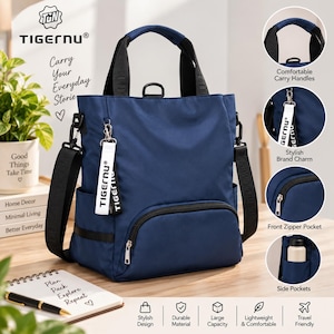 Puede incluir: Una mochila tipo tote azul marino de Tigernu con correas negras, un bolsillo frontal con cremallera, bolsillos laterales y un dije de marca blanco. El bolso cuenta con asas de transporte cómodas y un compartimento principal resistente.