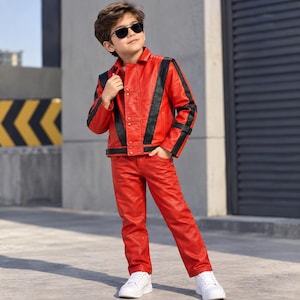 May include: A bright red leather jacket and matching red leather pants set featuring bold black vertical stripes running down the front and sleeves of the jacket. The jacket includes a button-up front closure and a classic collar design.
