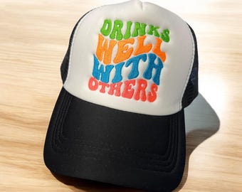Drinks Well With Others Trucker Hat