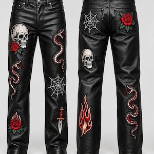 May include: Black trousers made of a leather-like material featuring embroidered patches. The front displays a skull, roses, snakes, a spiderweb, and a dagger. The back features a spiderweb, a rose, a skull, and flames, with snakes on the legs.