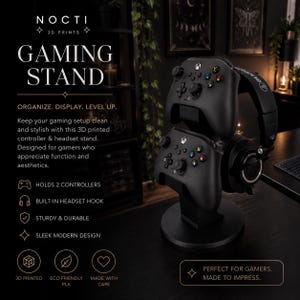 May include: A black 3D printed gaming stand featuring a circular base and a vertical support structure designed to hold two game controllers and one headset. The stand is displayed with two black game controllers and a black over-ear headset attached.