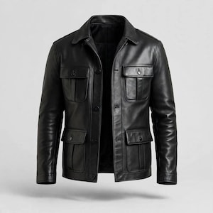 May include: A black leather jacket featuring a classic collar, a front button closure, and four large patch pockets with buttoned flaps on the chest and waist. The jacket has long sleeves with cuffs and a smooth, polished finish throughout the garment.