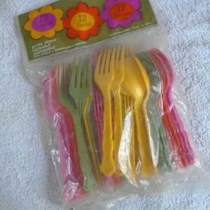 May include: A package of 36 extra heavy reusable disposable plastic cutlery in yellow, green, and pink. The package includes 12 spoons, 12 forks, and 12 knives. The package is labeled "36 Pieces" and has a floral design.