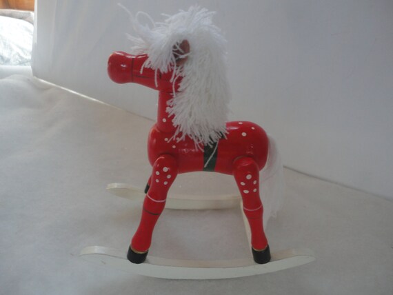 cheval a bascule plastique rouge