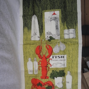 May include: A vintage kitchen towel with a green and white striped background. The towel features a red lobster, a lighthouse, and various bottles and jars. The text "FISH, OYSTERS, LOBSTERS" is printed on the towel.