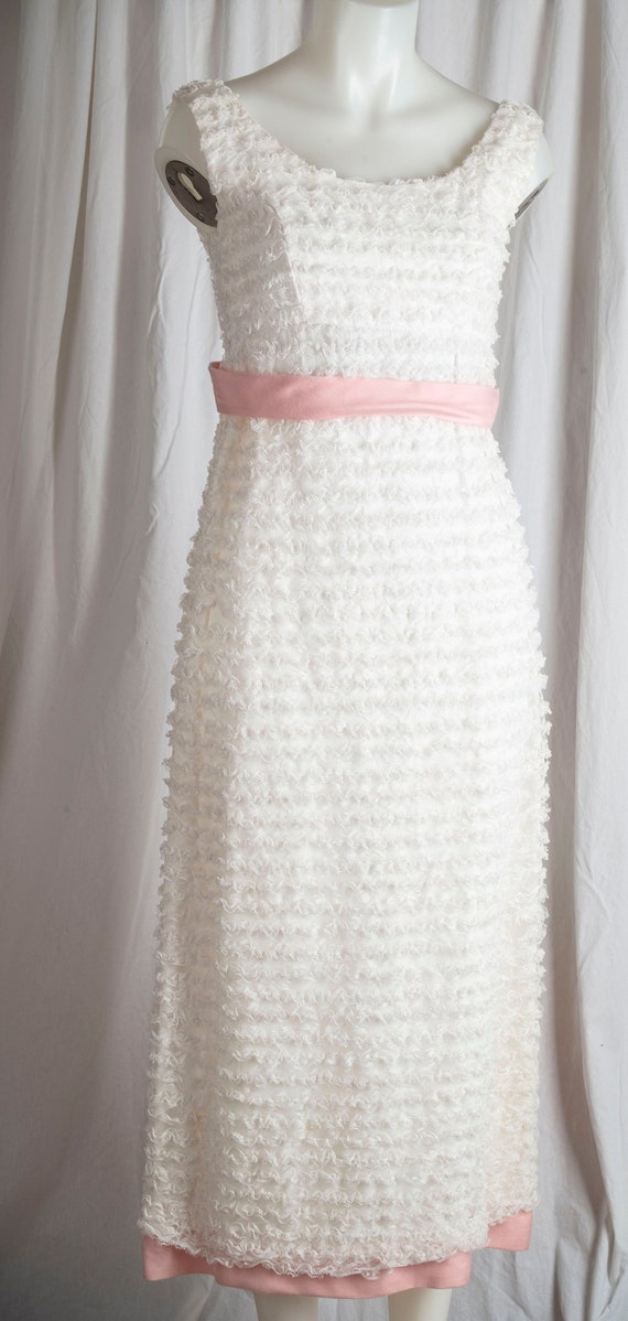 1960s sleeveless, layered lace formal w/pink trim.