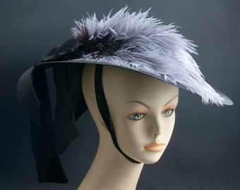 Upcycled Betty Goodwin black wide brimmed victorian hat w lavender ostrich feather detail and chinstrap.