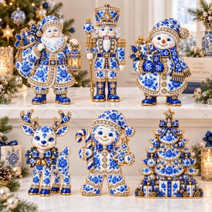 May include: A set of six Christmas figurines featuring a Santa Claus, a nutcracker, a snowman, a reindeer, a gingerbread person, and a Christmas tree, all decorated with a blue and white floral pattern and gold trim accents throughout.