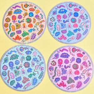 May include: Four circular stickers featuring a holographic finish and a variety of colorful, stylized illustrations of microorganisms, bacteria, and viruses. Each sticker displays a unique background color including peach, light blue, and lavender.