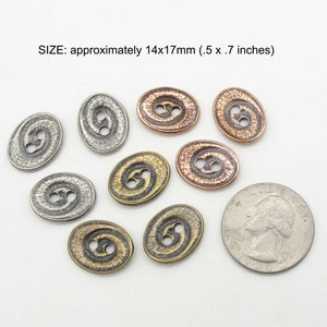 May include: Nine oval-shaped metal buttons with a textured surface and two holes. The buttons are in various shades of silver, copper, and bronze. The buttons are approximately 14x17mm (0.5 x 0.7 inches).