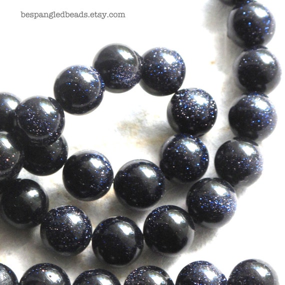 Packet of 6 x Blue Goldstone 8mm Coin-Shaped Flat-Backed Cabochon CA16687-1 Charming Beads Packet of 6 x Blue Goldstone 8mm Coin-Shaped Flat-Backed Cabochon CA16687-1 Charming Beads