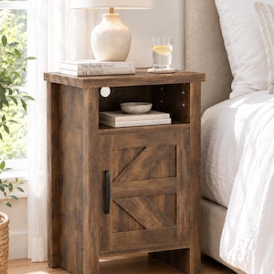 May include: A brown wooden nightstand with a distressed finish, featuring an open top shelf and a lower cabinet door with a diagonal cross-brace design and a black metal handle. The nightstand has a rectangular top surface and four legs.