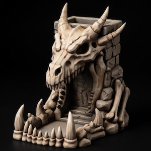 May include: A beige dice tower shaped like a dragon skull resting on a stone-like base. The structure features a hollow interior, a wide opening at the front, and a series of sharp, tooth-like protrusions lining the bottom edge.