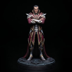 May include: A painted miniature figurine of a standing figure with arms crossed, wearing dark red and gold armor with silver accents. The figure has dark hair and stands on a circular, cracked stone-textured base against a black background.