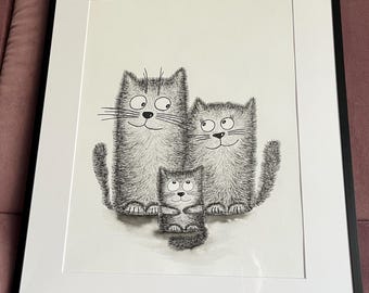 May include: A framed black and white illustration of a cat family. The artwork features three stylized cats with expressive faces and fluffy fur. The cats are arranged in a vertical composition, with the smallest cat in the center.