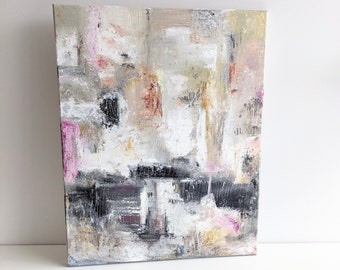 May include: Abstract painting on canvas with a mix of white, gray, black, and pink paint. The painting has a textured surface and a modern style.
