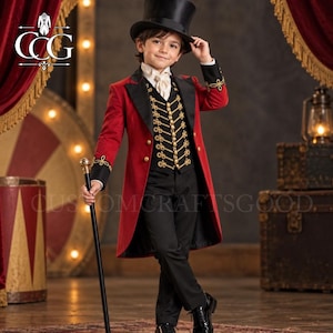 May include: A ringmaster costume featuring a red tailcoat with black lapels and gold embroidery, a black vest with gold braided detailing, black trousers, a white cravat, and a black top hat. A black cane with a gold handle is held in one hand.