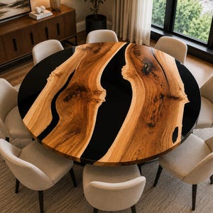 May include: A round dining table featuring a natural wood slab with a prominent live edge and a glossy black resin inlay that runs through the centre, accompanied by eight upholstered chairs with light beige fabric and dark wooden legs.