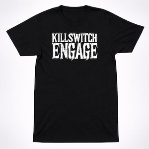 May include: A black short-sleeved t-shirt featuring the text KILLSWITCH ENGAGE printed in a distressed white font across the chest. The garment has a crew neckline and a standard fit, showcasing a bold graphic design on the front centre.
