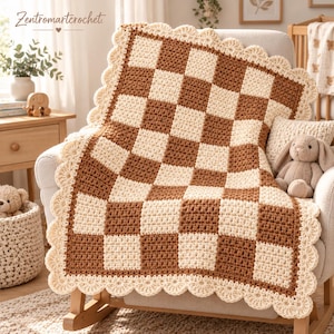 May include: A handmade crochet blanket featuring a checkered pattern of alternating cream and brown squares. The blanket is finished with a decorative scalloped edge in cream yarn. The text Zentromartcrochet is visible in the upper left corner.
