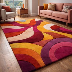 May include: A rectangular area rug featuring a bold, abstract pattern of overlapping curved shapes and waves. The design incorporates a vibrant color palette of deep purple, bright orange, warm yellow, soft cream, and shades of red.