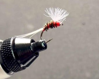 Hand-tied red attractor nymp/dry fly