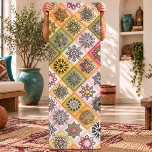 May include: A rectangular yoga mat featuring a repeating pattern of diamond-shaped tiles. Each tile contains a unique, intricate mandala design in shades of pink, green, yellow, and orange, set against a soft, multi-colored gradient background.